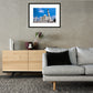 Framed and mounted photograph of the Taj Mahal in Agra hanging on a wall above a sofa and cupboard